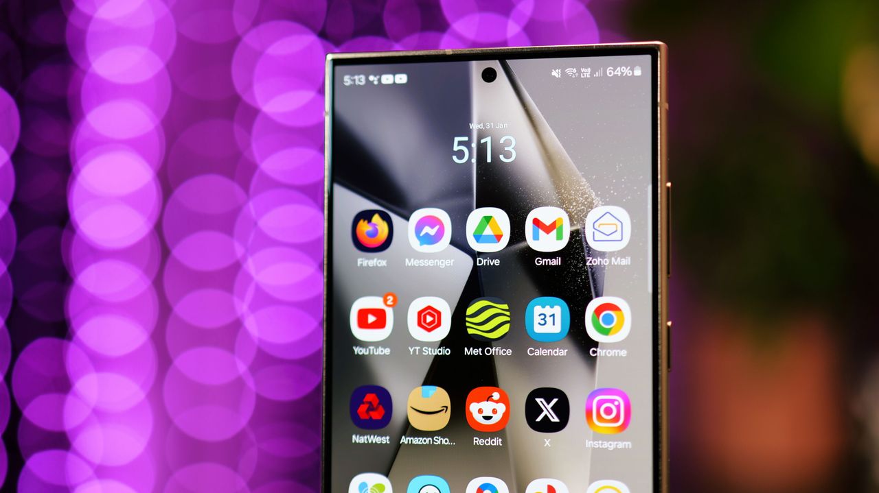 Close up of Samsung Galaxy S24 Ultra screen with purple lights blurred in the background