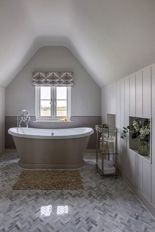 herringbone tiled floor in country style modern bathroom