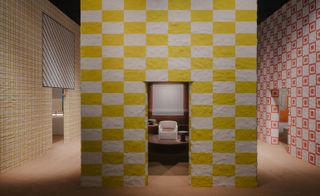 Hermes home collections at salone del mobile in Milan shown inside lime plaster structures with striped surfaces