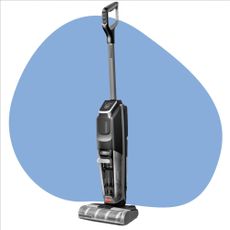 Bissell vacuum mop on a white background with a blue splodge