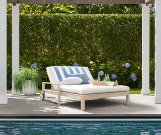 An Indio Eucalyptus Double Outdoor Chaise Lounge with Wheels