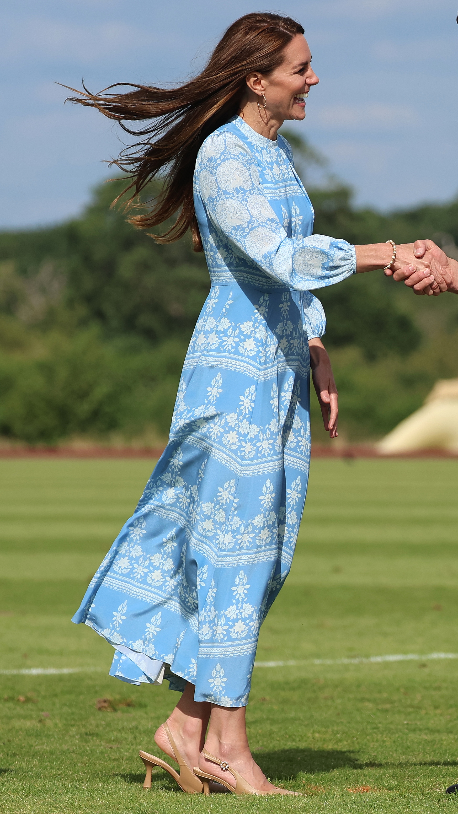 Catherine, Princess of Wales shakes hands with Malcolm Borwick (not pictured) during the presentations as they attend the Royal Charity Polo Cup 2023