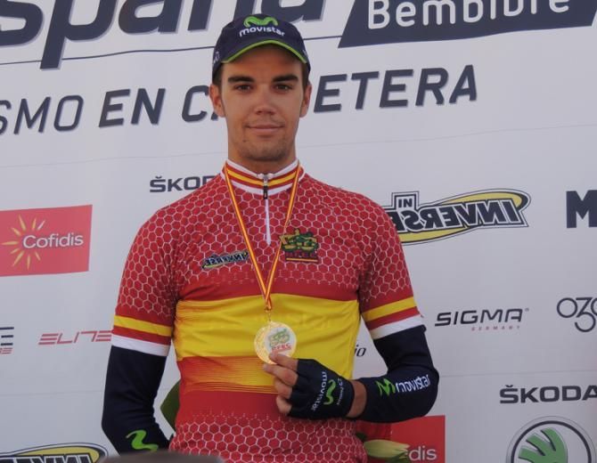 Jesus Herrada (Movistar) shows his red and yellow maillot and his medal.