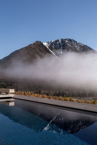 Swimming pool against mountain backdrop
