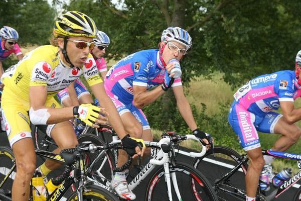 Cunego has a sip and a bit of conversation to pass the time.