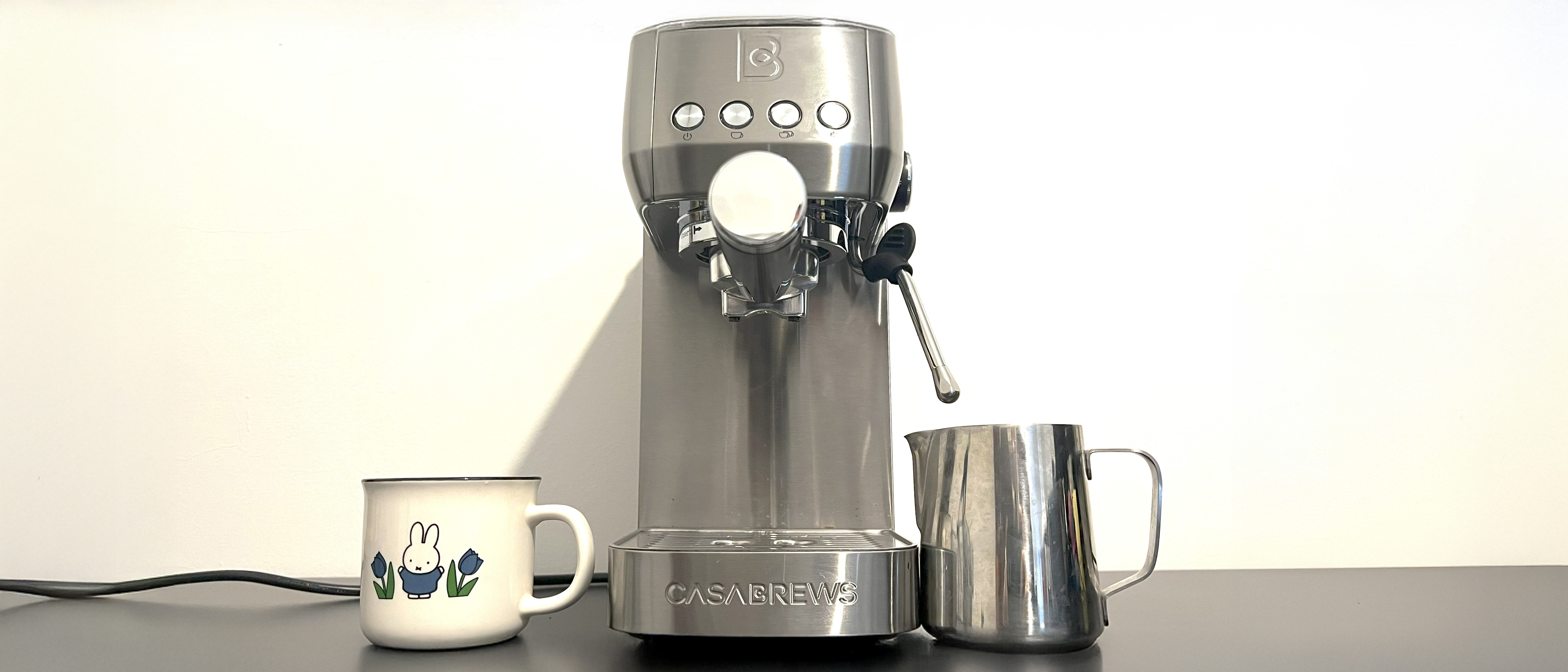 Casabrews 3700 Essential on kitchen counter with milk jug and mug