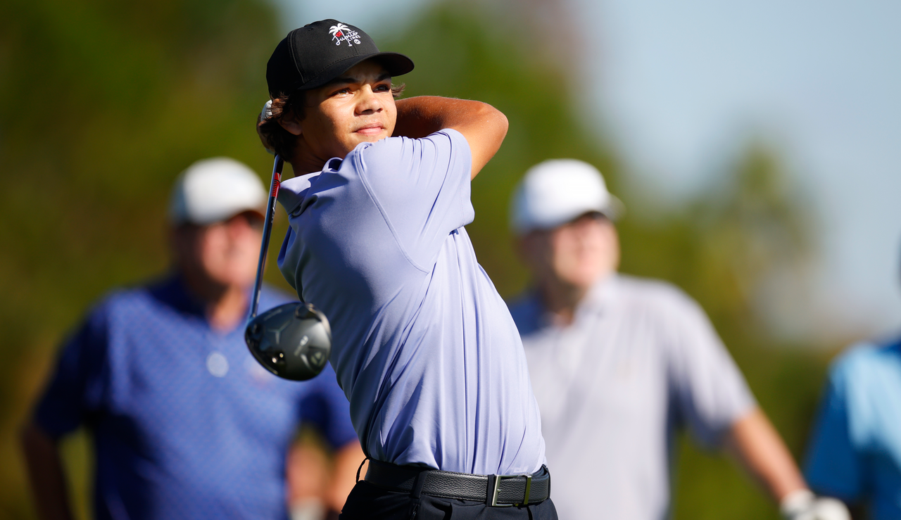 Charlie Woods hits a tee shot with a driver