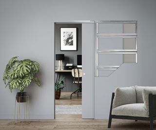 Grey room with exposed cross-section of ECLISSE pocket door in action