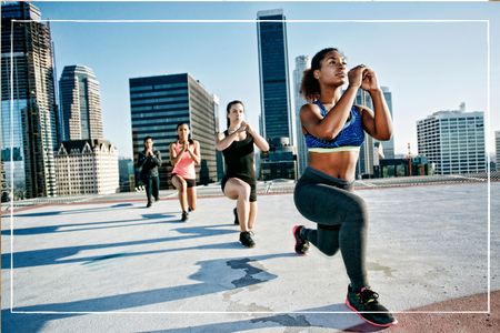 group of women taking part in thigh exercises