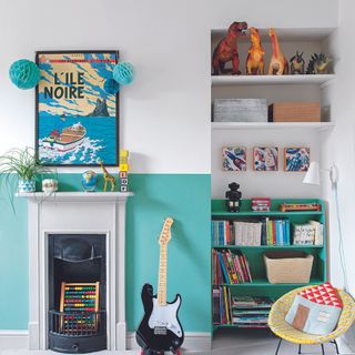 Blue and white children's room with guitar and toys on the shelves