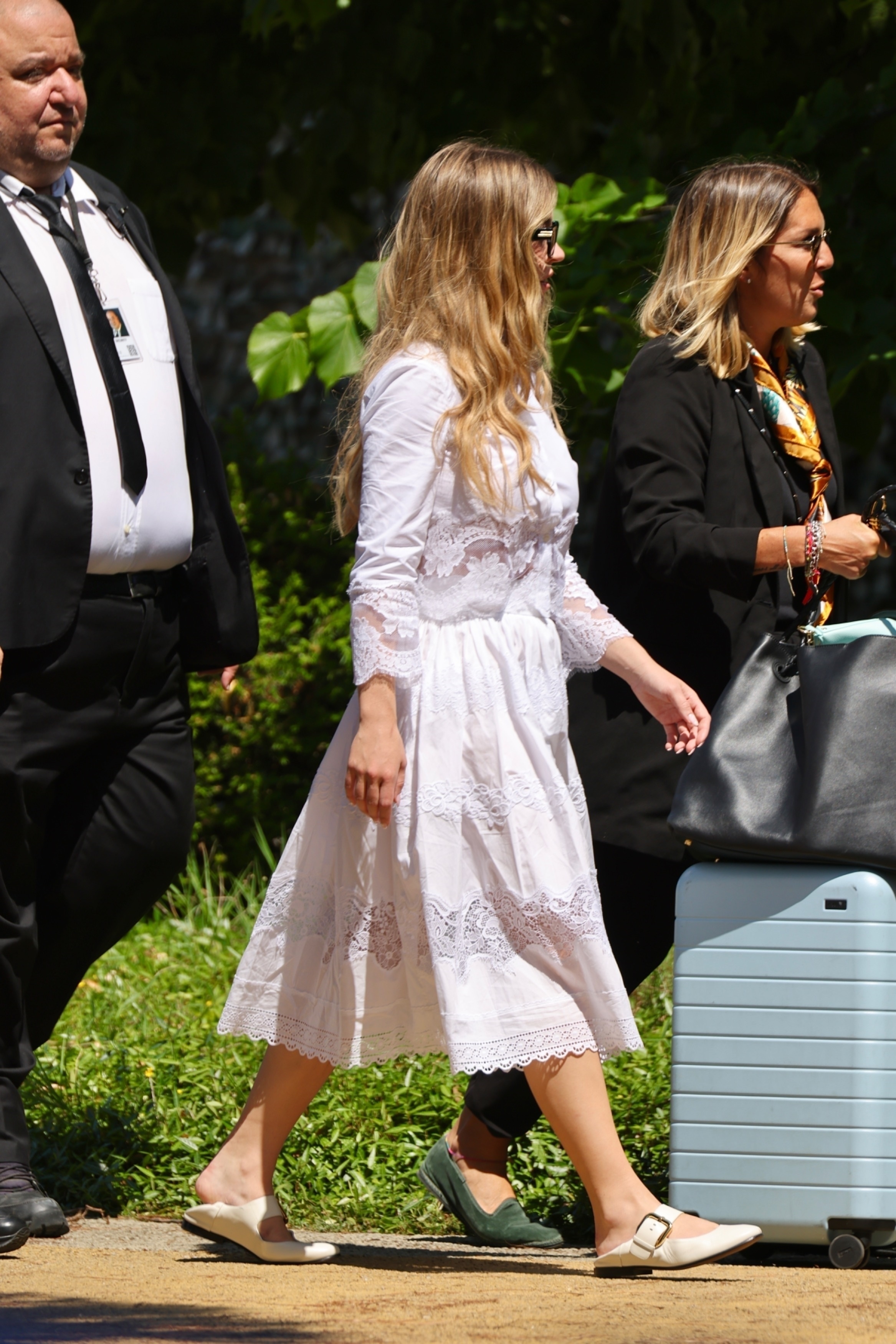 Sydney Sweeney left the Bezos-Sànchez wedding in a white skirt set and Mary Jane/mule hybrid shoes.