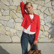 Megan Adelaide in a red cardigan