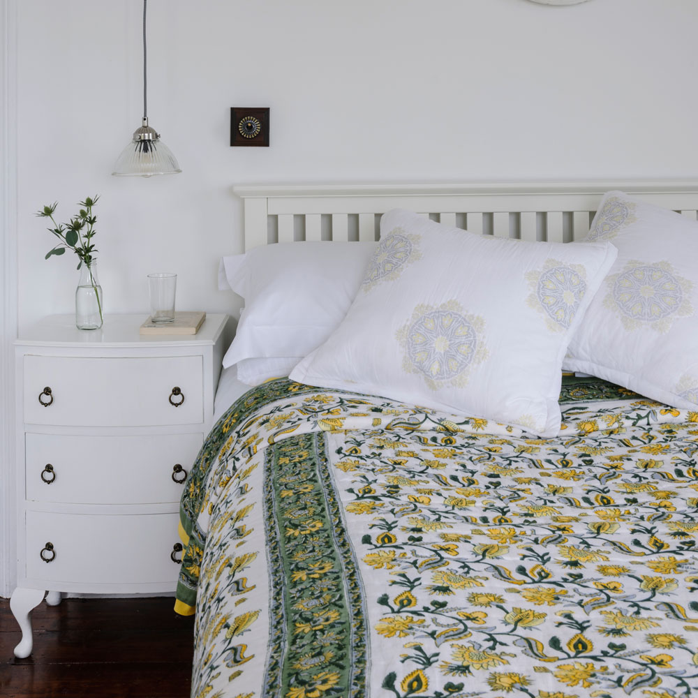 bedroom with wooden flooring and white drawer