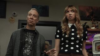 Stuart and Denise standing behind comic shop counter in magical universe in Stuart Fails to Save the Universe Season 1
