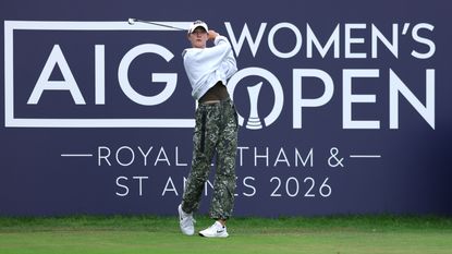 Nelly Korda hits a tee shot in front of an AIG Women's Open board