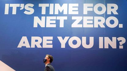 A man climbs stairs on day two of the 26th United Nations Climate Change Conference (COP26) in Glasgow, Scotland.