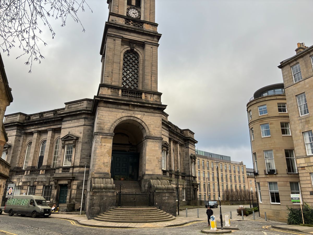 A large church with an arched front and a tower