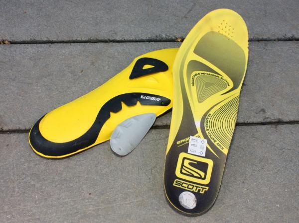 The tunable insoles include removable arch and metatarsal pads