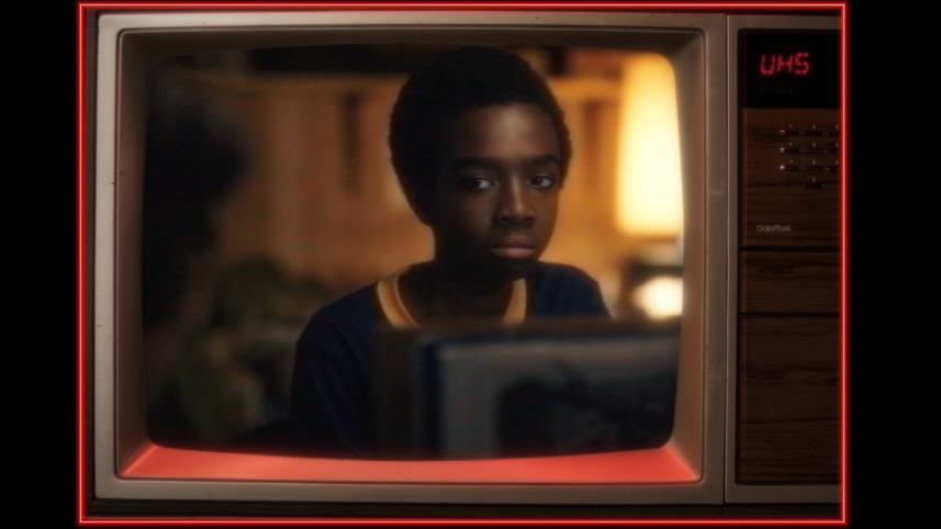 A still from the Netflix series Stranger Things, framed in a CRT TV with VHS-style picture quality.