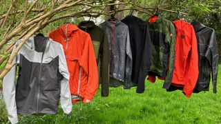 Group of cycling jackets hanging from a tree