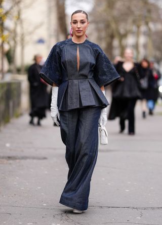 French street style - woman wearing a denim two-piece