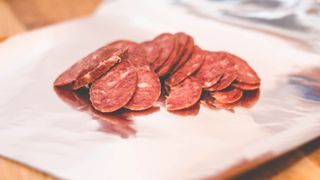 Pepperoni slices on foil