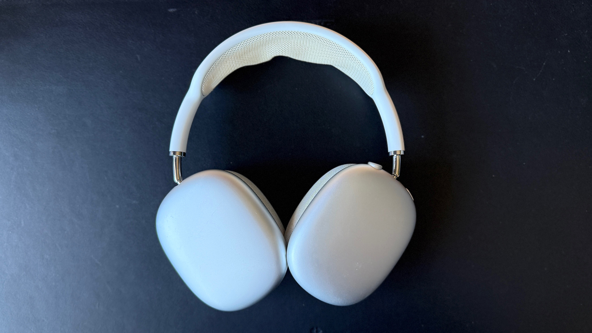 My AirPods Max on a black leather background. 