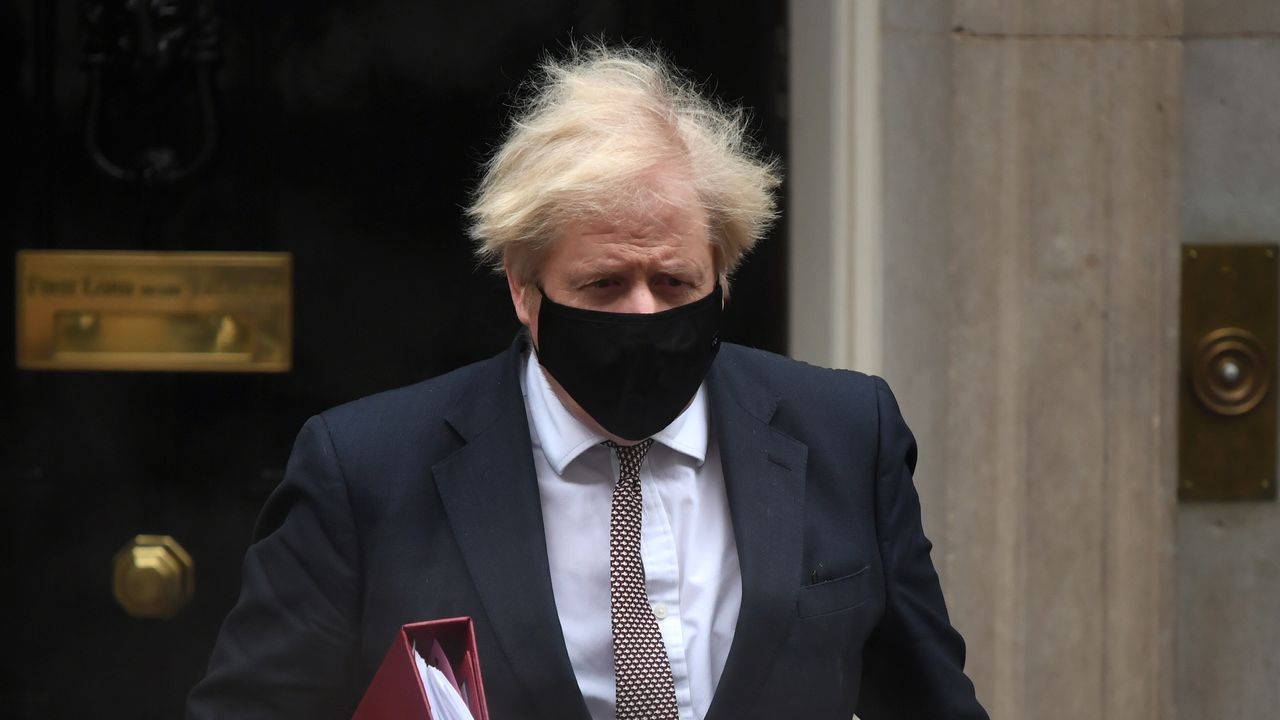 Boris Johnson leaves number 10 Downing Street for PMQs.