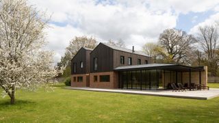 contemporary self build with deep overhanging roof
