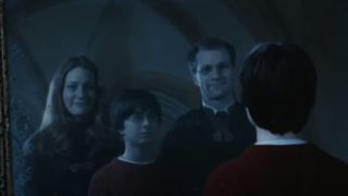 Harry looking at his parents in Mirror of Erised in Harry Potter and the Sorcerer's Stone.