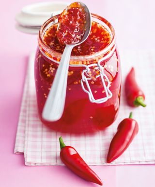 chilli jam with spoon and glass jar