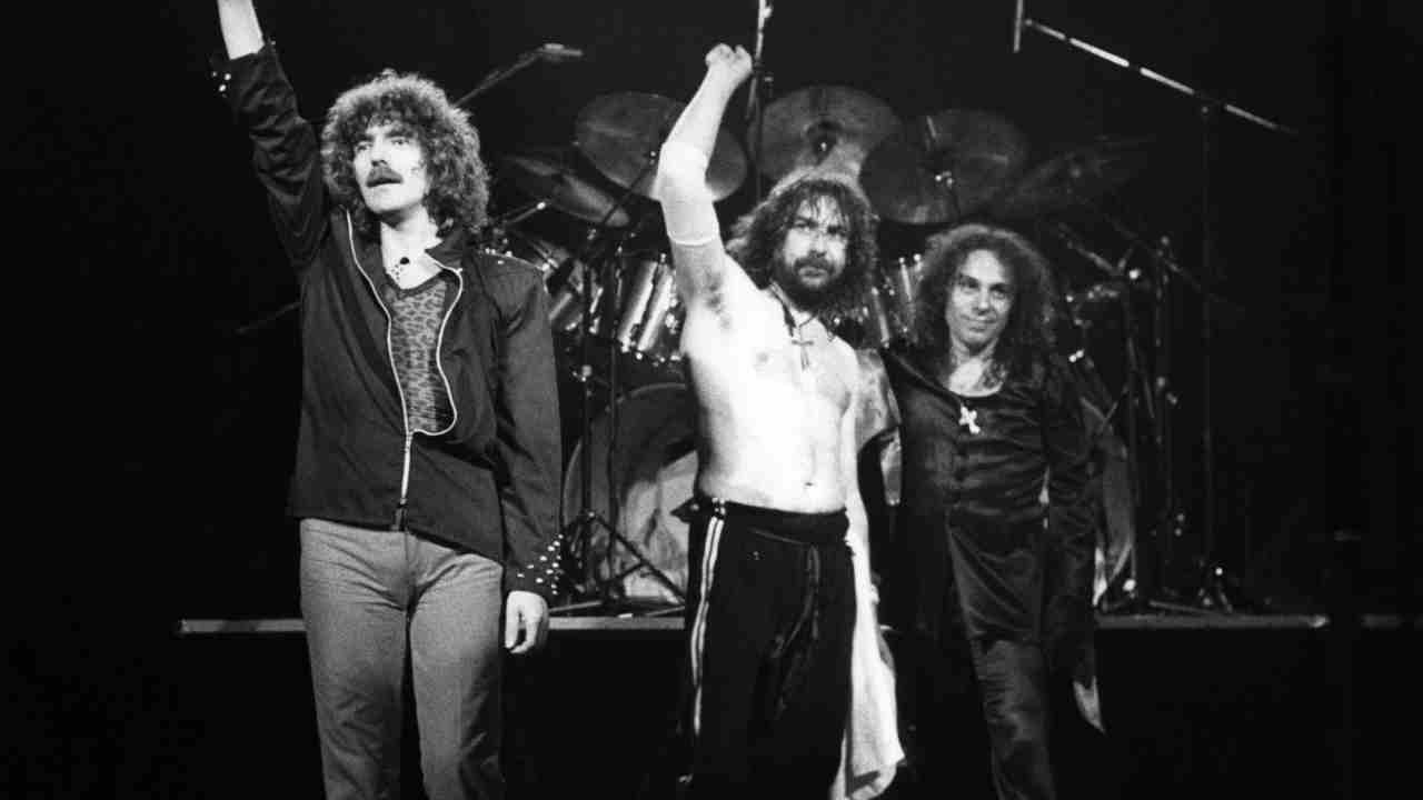 Black Sabbath performing onstage in the early 1980s