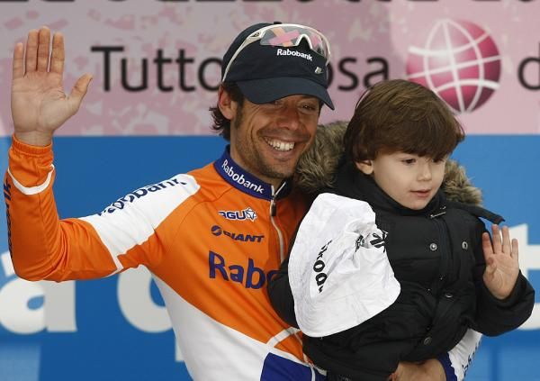 Freire brings his son up onto the podium to enjoy the view.