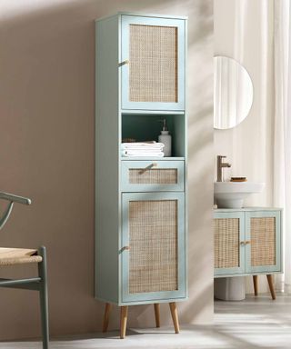 pale green wooden storage units with wicker fronted panels
