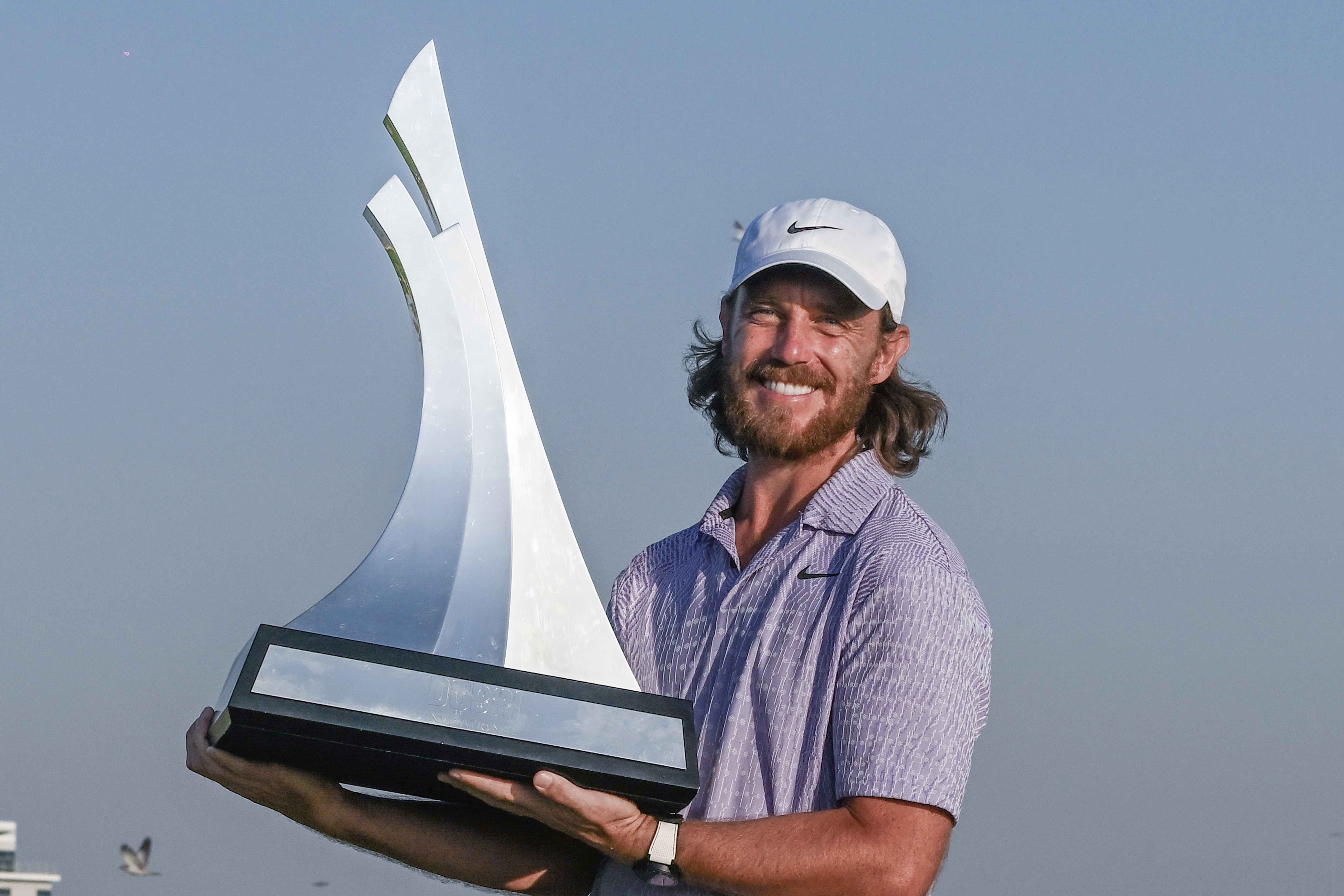 Tommy Fleetwood holds the Dubai Invitational trophy
