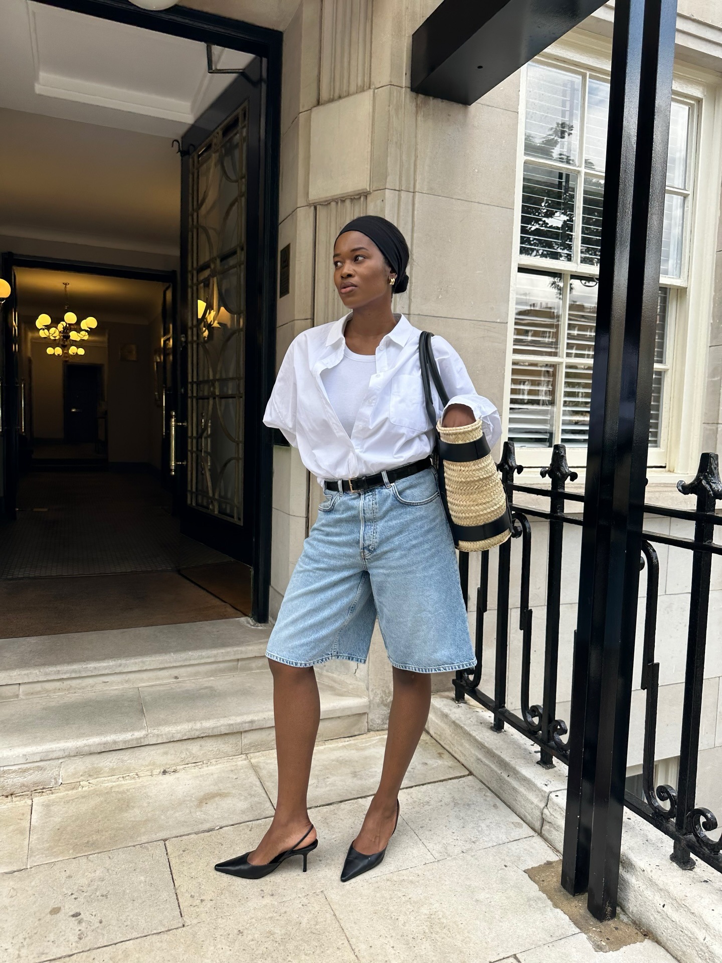 Influencer wearing button-down shirt outfit.