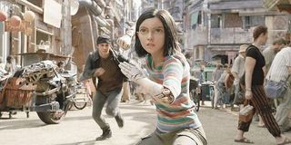 Alita: Battle Angel Alita takes a fighting stance on the streets of Iron City