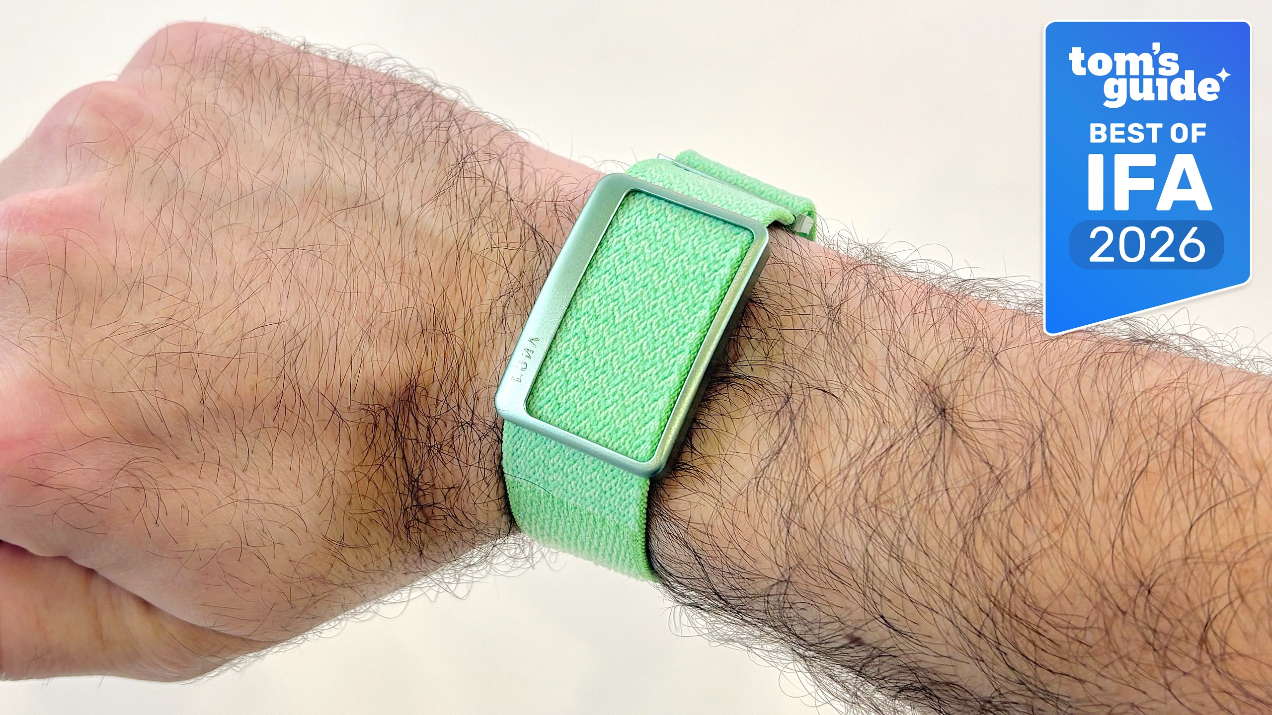 Close-up of the Luna Band in green on a user's wrist