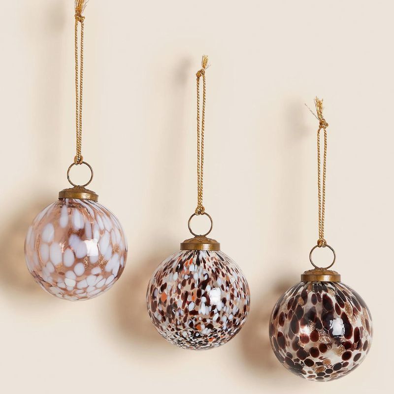 Multi-coloured tortoiseshell glass baubles is a festive tortoiseshell homeware piece.