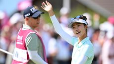 Grace Kim smiles and waves to the crowd after winning the 2025 Amundi Evian Championship