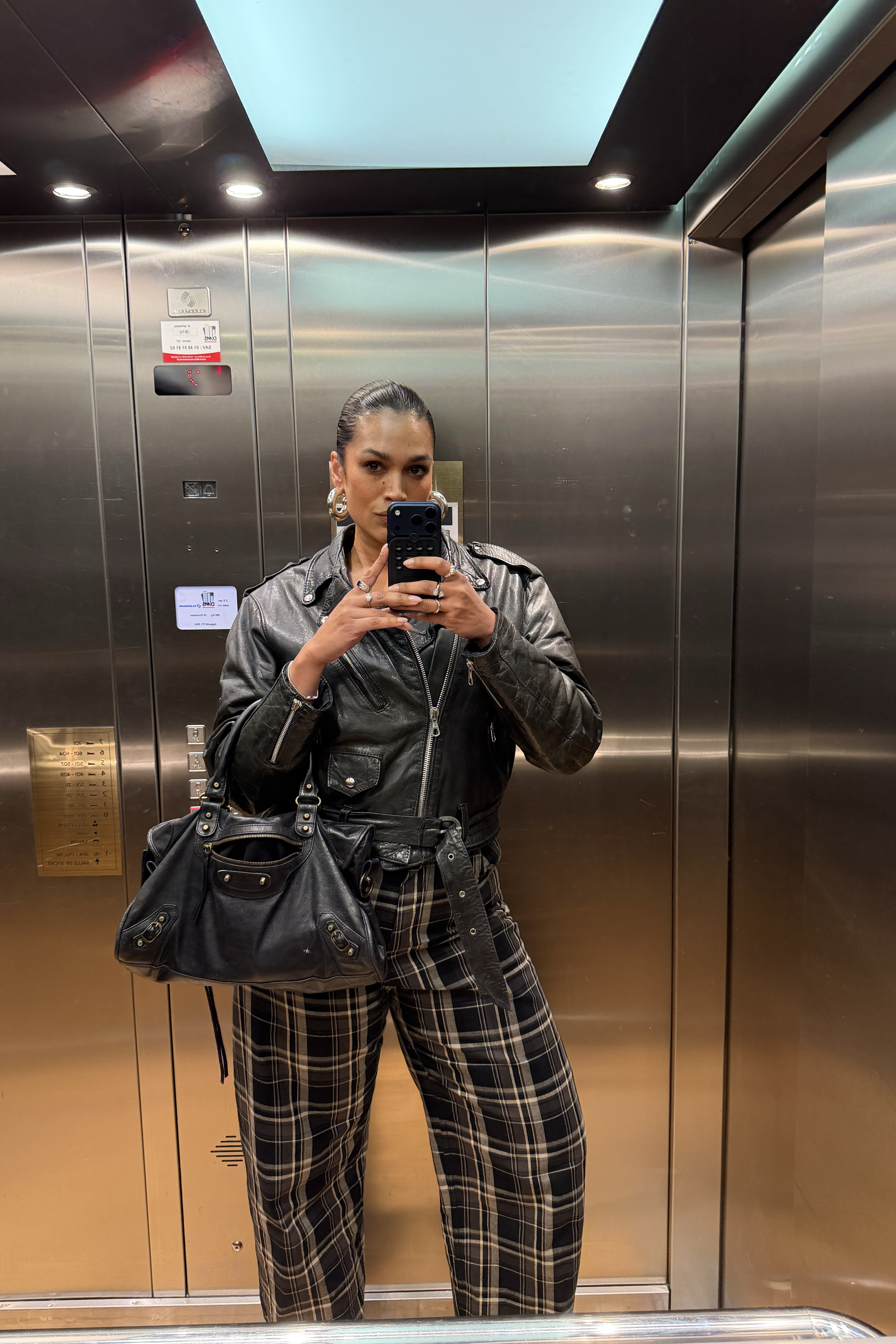 Jennifer Atilemile wearing plaid pants.