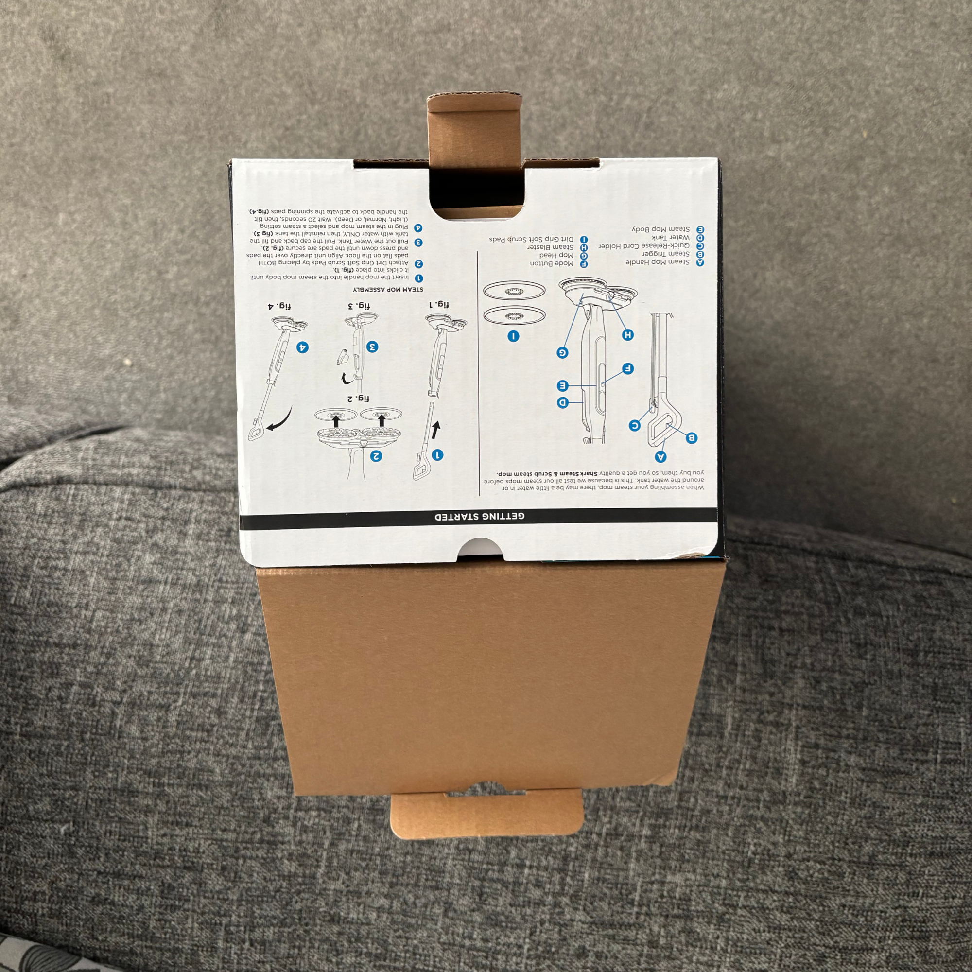 Top-down view of the Shark Steam & Scrub packaging showing product instructions