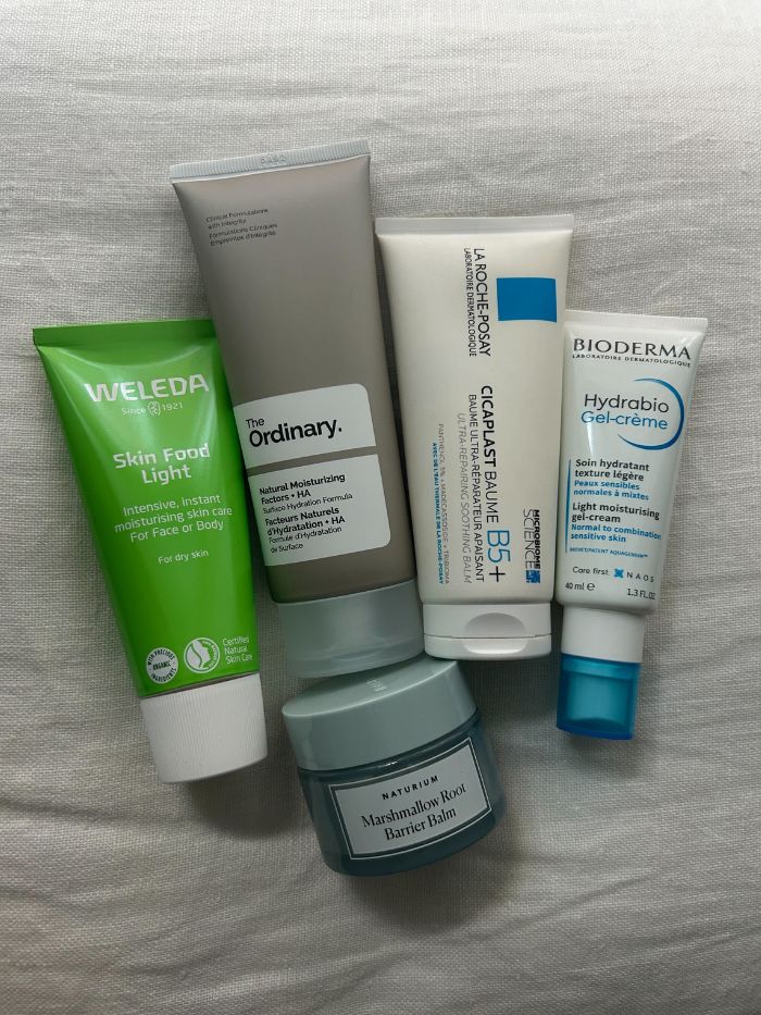 A selection of affordable moisturisers on a white linen background