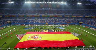 A large Spanish flag flies over the pitch during the opening ceremony prior to the Group B match between South Africa and Spain at the 2002 FIFA World Cup Korea/Japan in Daejeon, 12 June 2002. It is the third opening round match for both sides in the 2002 World Cup.