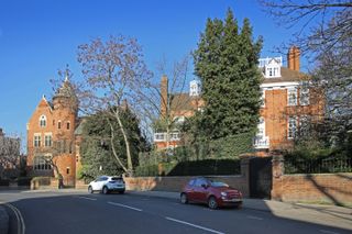 The Tower House (left), owned by Led Zeplin's Jimmy Page, next door to Robbie Williams' house.
