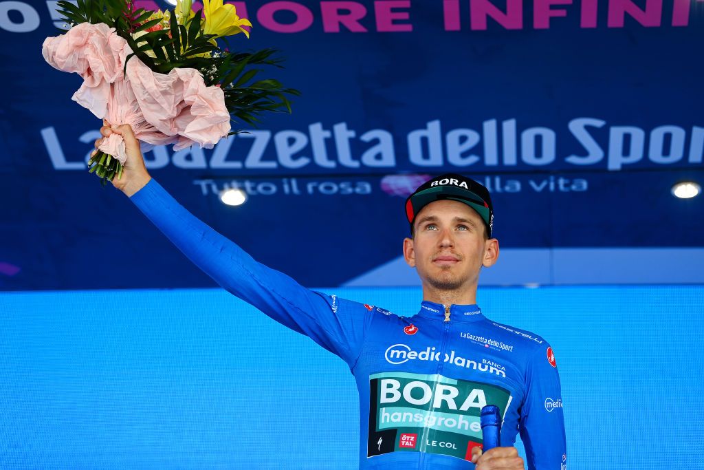 MESSINA ITALY MAY 11 Lennard Kmna of Germany and Team Bora Hansgrohe celebrates winning the blue mountain jersey on the podium ceremony after the 105th Giro dItalia 2022 Stage 5 a 174km stage from Catania to Messina Giro WorldTour on May 11 2022 in Messina Italy Photo by Tim de WaeleGetty Images