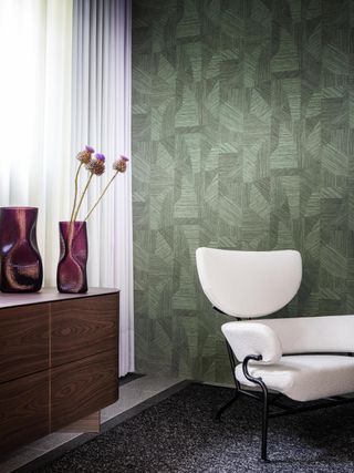 A living room with nature-inspired wallpaper