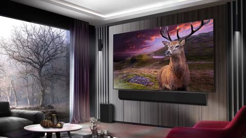 LG OLED G3 marketing image of the TV mounted on a wall in a living room displaying a Deer in a dramatic nature scene.