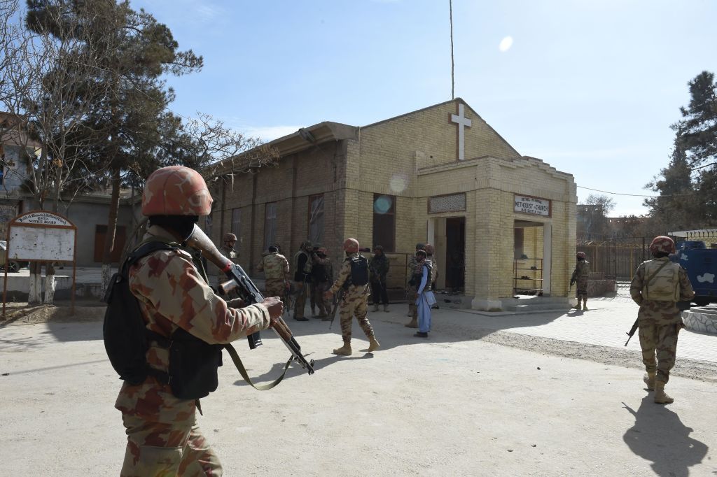 Pakistani security personnel take position after suicide bombers attacked a Methodist church during a Sunday service in Quetta on December 17, 2017. 