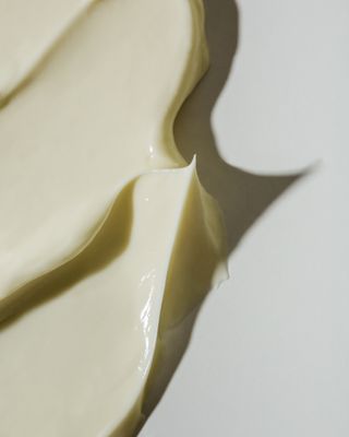 Up-close texture of a yellow skin cream